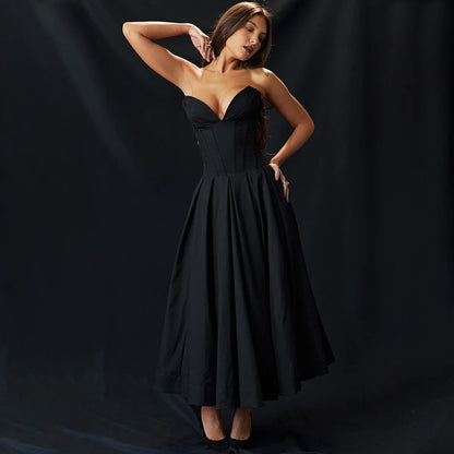 A woman wearing strapless black dress