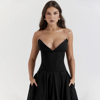 A woman wearing strapless black dress